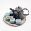 art ceramic tea pot and cups with blue enamel