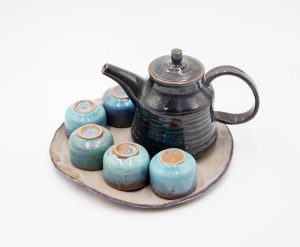 art ceramic tea pot and cups with blue enamel